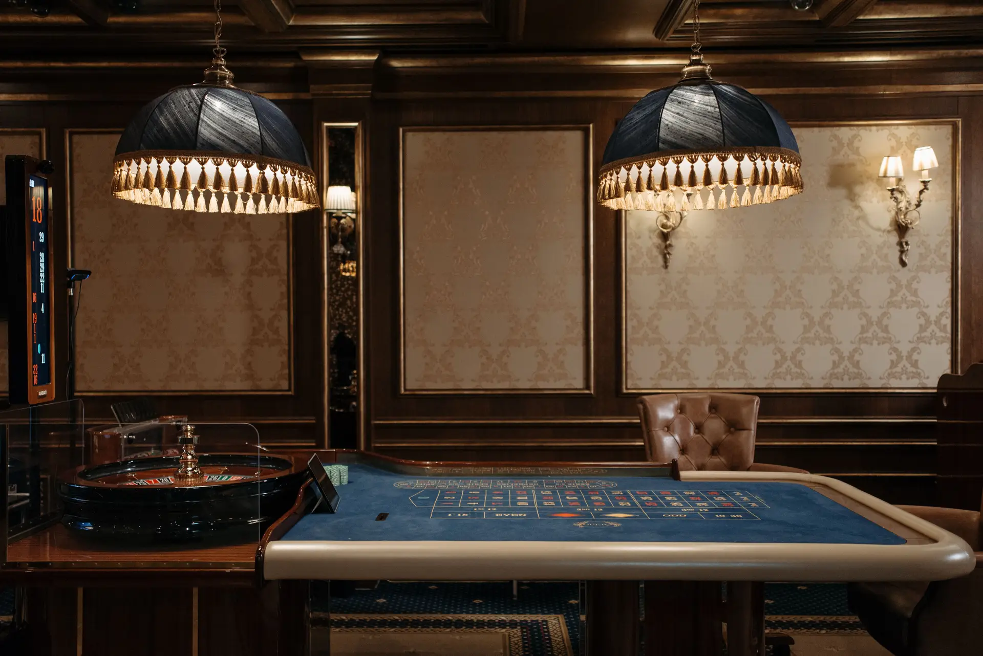 Sophisticated casino floor interior with roulette tables and architectural lighting